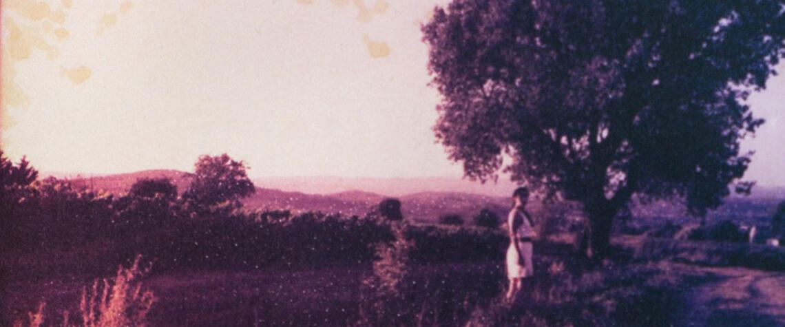 a welcome look back hazy memories from a summer in france, a female figure looks back at the camera with no sign of intent